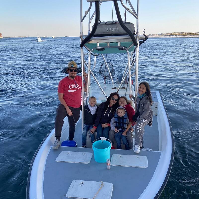 A full 6-pack bay fishing vessel, mom dad and kids on spring break