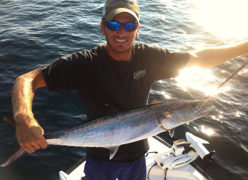 Captain Nick Kirby with a king mackerel trolling trip