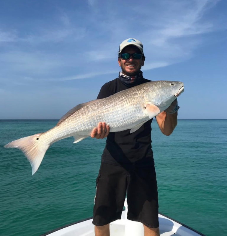 Captain Nick with a massive redfish