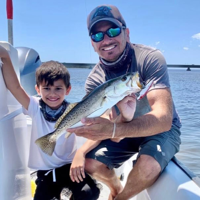 Captain Nick and his boy fishing for speckled trout inshore Okaloosa Island.