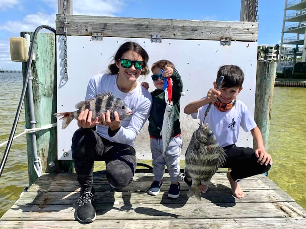 Mom and Kids On A Little  Adventure. Catching Fish On Vacation