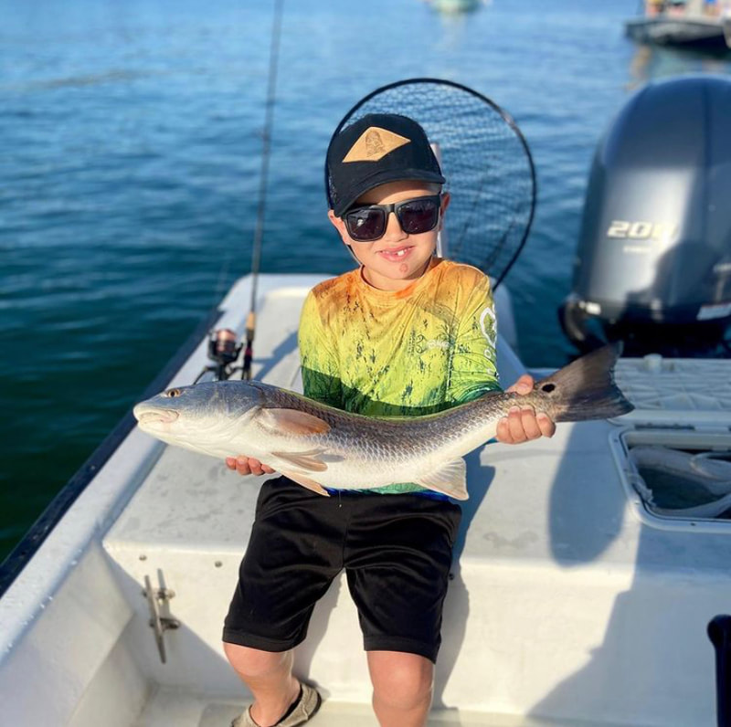 Kid fishing released a nice redfish